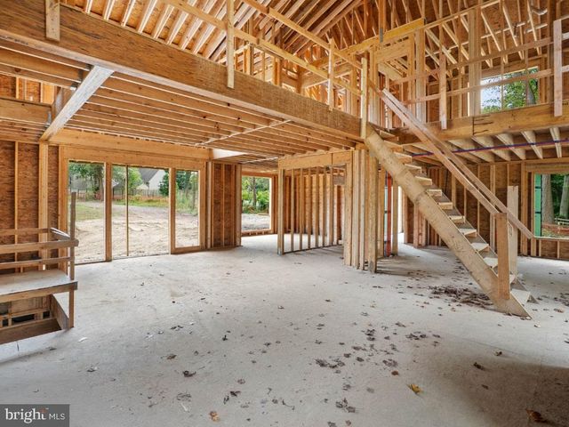 a view of a room with wooden floor and roof