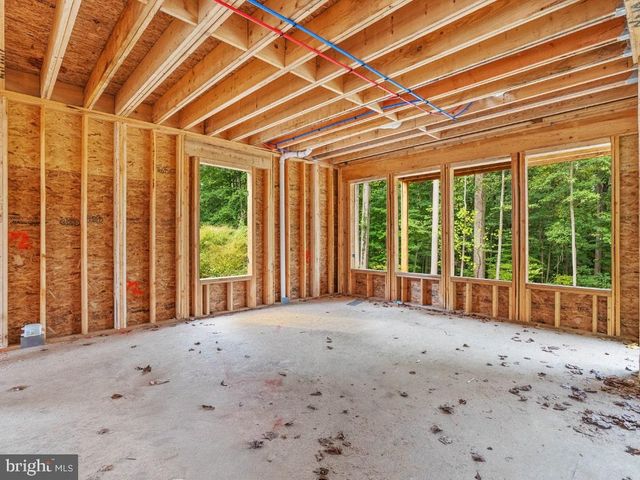 a view of a room with large windows