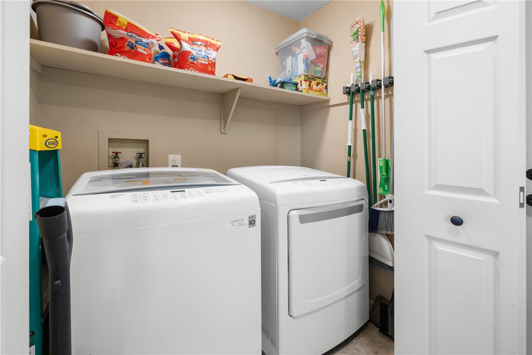119 Freedom Drive, Unit 8 Clemson, SC 29631 - Photo 16 of 39 This dedicated utility space features convenient storage and essential laundry appliances.