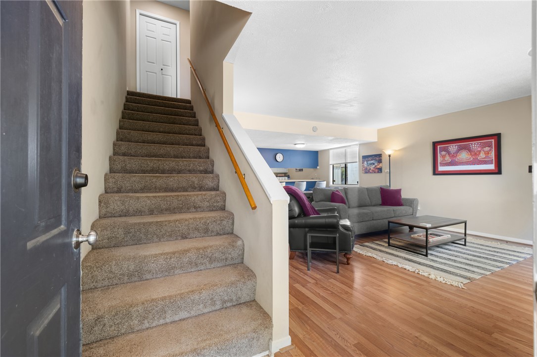 119 Freedom Drive, Unit 8 Clemson, SC 29631 - Photo 17 of 39 This inviting home offers an open-concept living space with warm wood floors and abundant natural light.