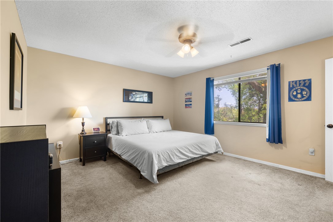 119 Freedom Drive, Unit 8 Clemson, SC 29631 - Photo 18 of 39 This cozy bedroom features a neutral color palette, creating a serene and inviting atmosphere for rest and relaxation.