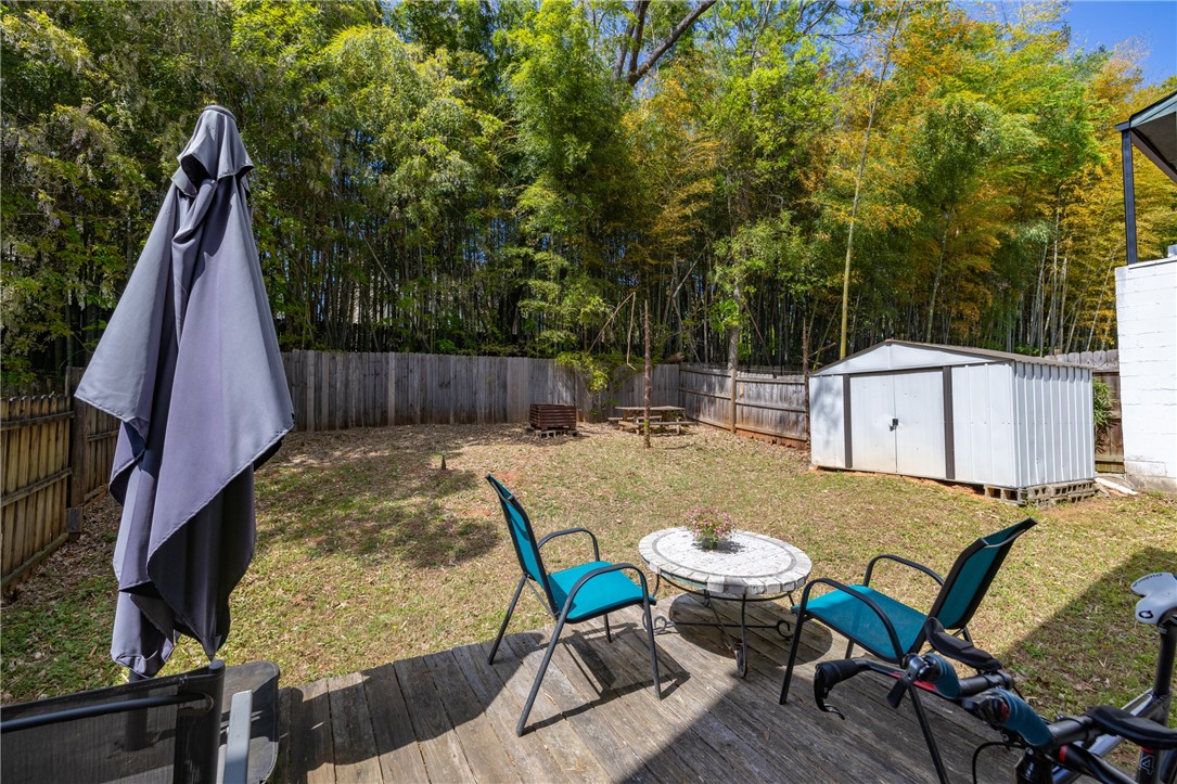 119 Freedom Drive, Unit 8 Clemson, SC 29631 - Photo 24 of 39 This outdoor space offers a private retreat with a wooden deck and ample room for recreation.