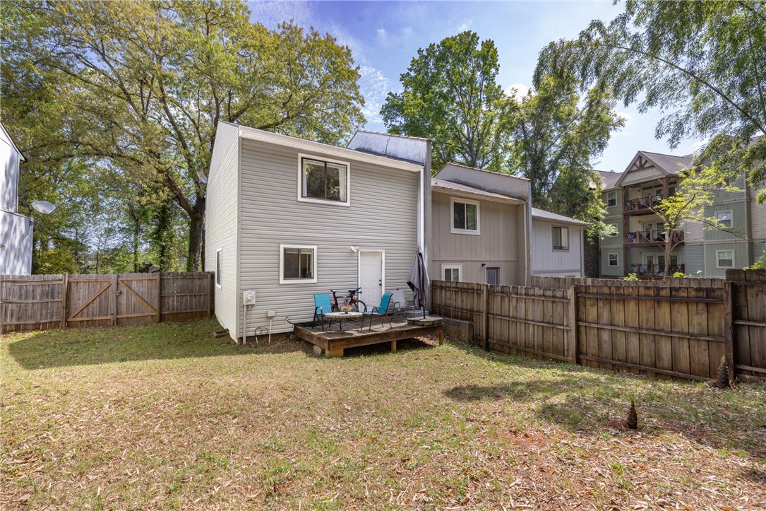119 Freedom Drive, Unit 8 Clemson, SC 29631 - Photo 26 of 39 This outdoor space offers a private retreat with a wooden deck, perfect for relaxation and enjoyment.