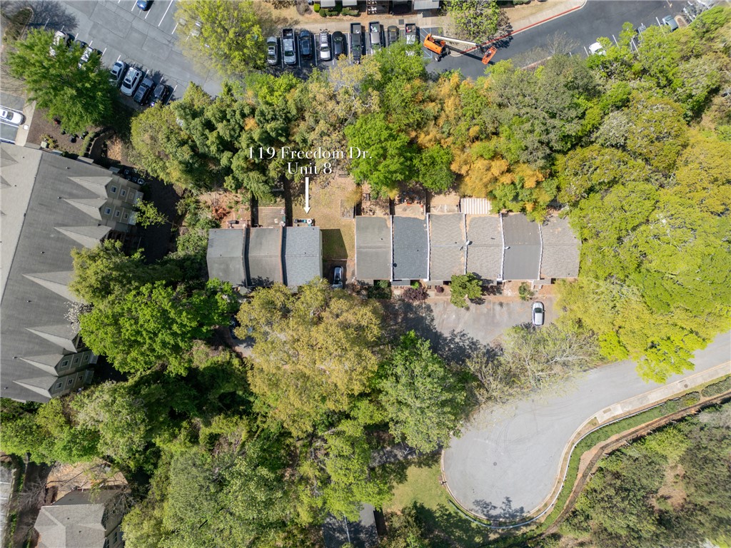 119 Freedom Drive, Unit 8 Clemson, SC 29631 - Photo 28 of 39 An aerial view showcases townhomes nestled amidst a lush, verdant landscape with ample parking.