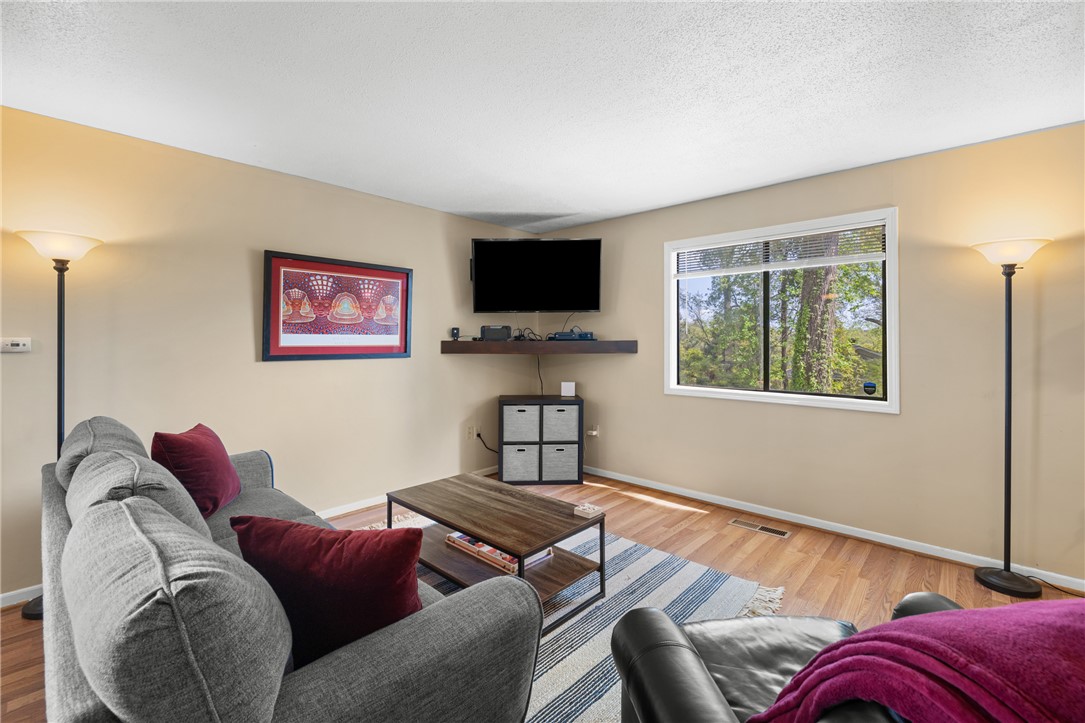 119 Freedom Drive, Unit 8 Clemson, SC 29631 - Photo 6 of 39 This living room features ample natural light and durable hardwood flooring.