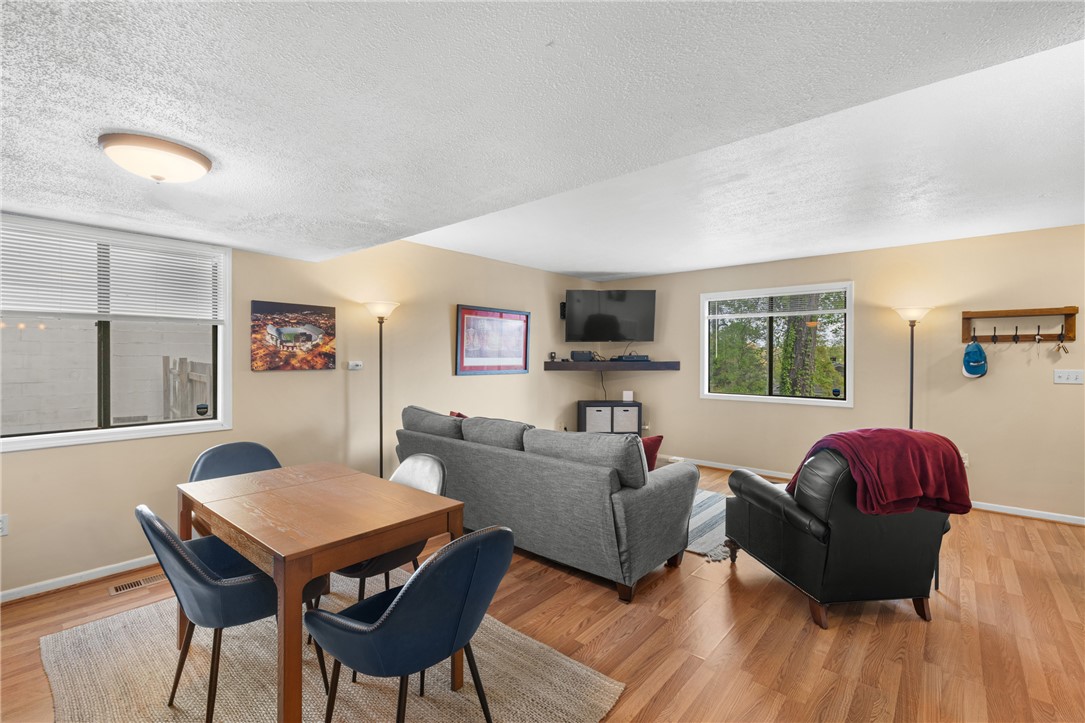 119 Freedom Drive, Unit 8 Clemson, SC 29631 - Photo 10 of 39 This versatile space seamlessly combines dining and living areas for modern comfort.