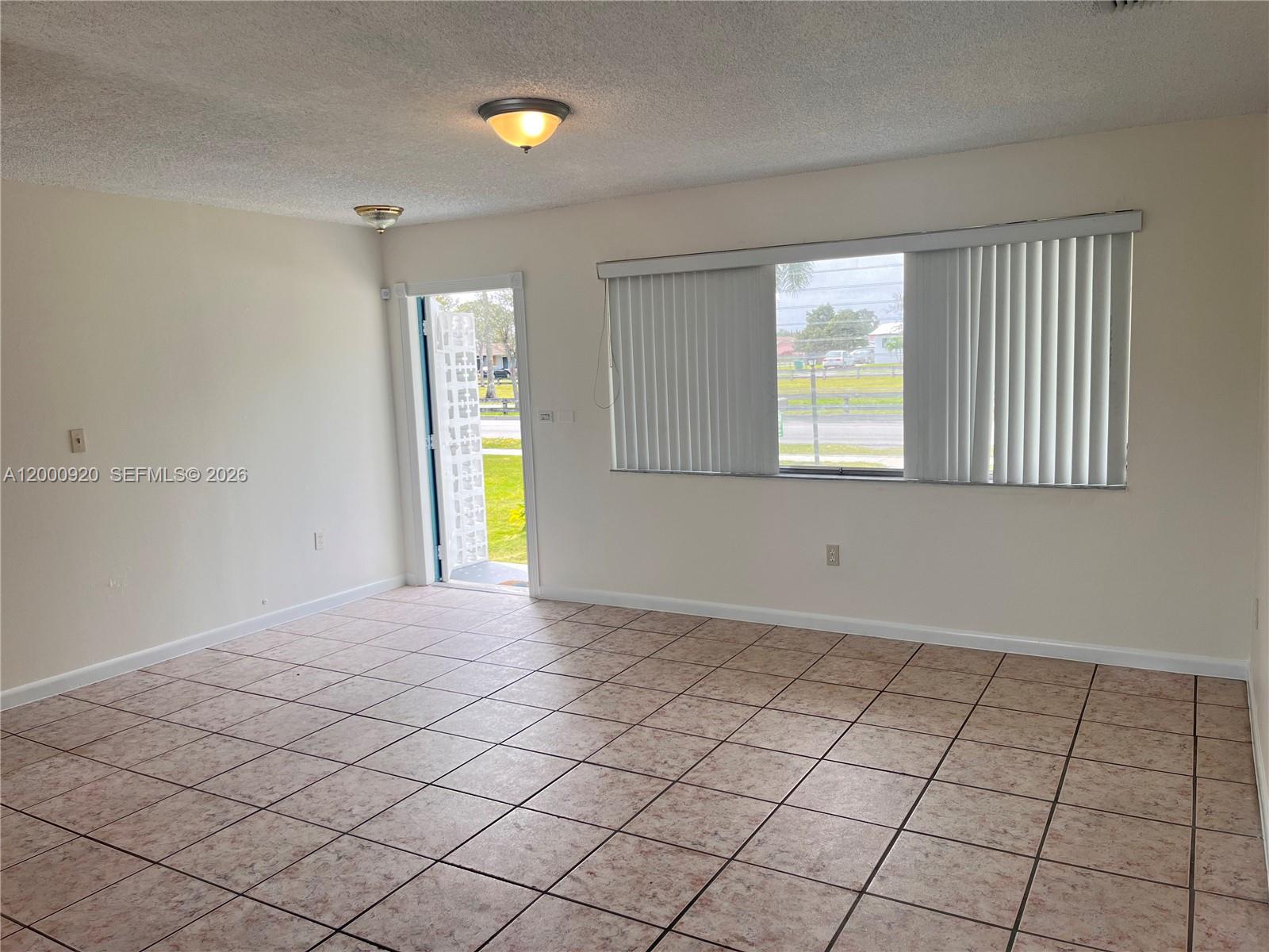 20341 Southwest 117th Avenue Miami, FL 33177 - Photo 3 of 12 an empty room with windows