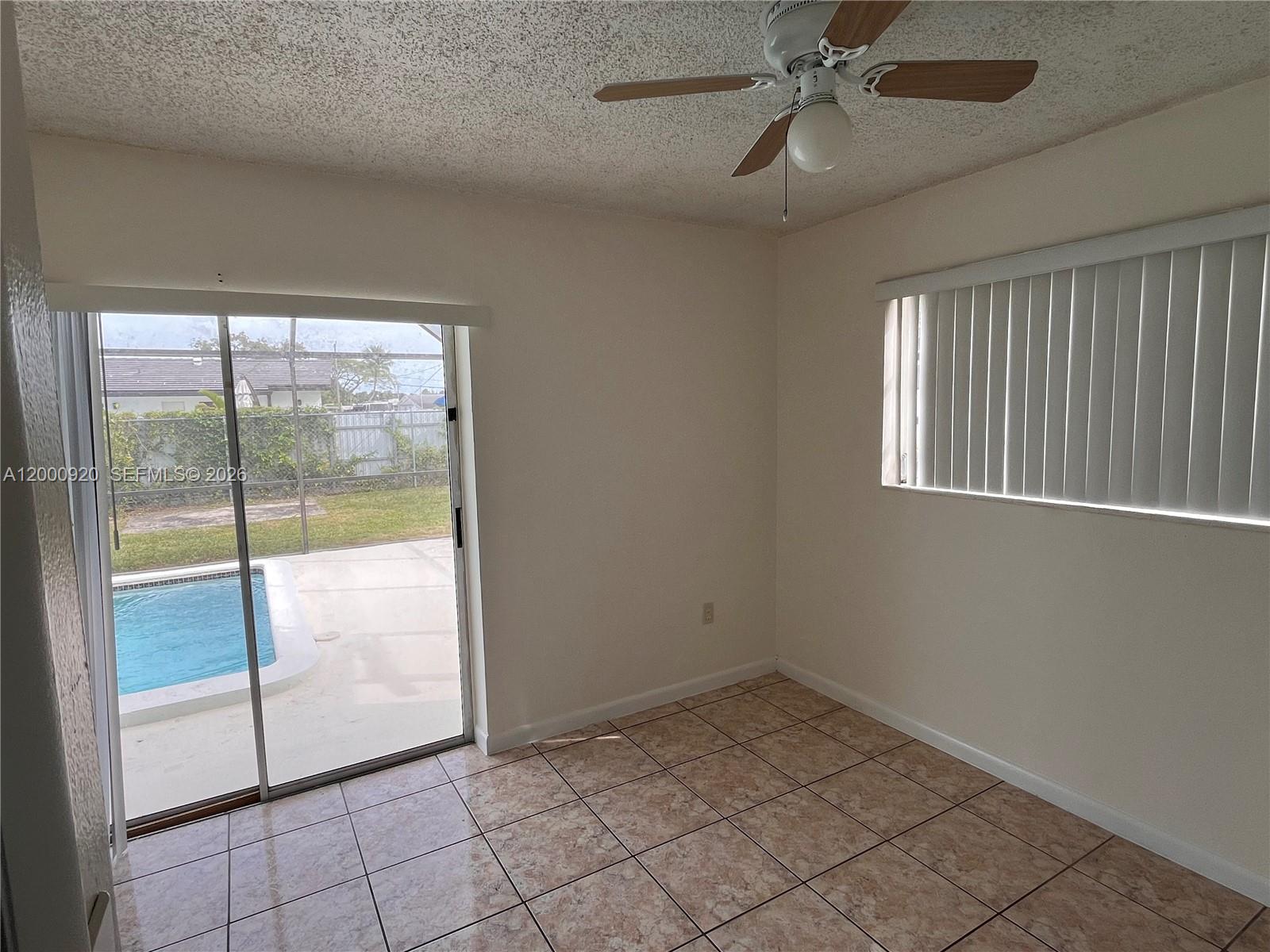 20341 Southwest 117th Avenue Miami, FL 33177 - Photo 9 of 12 a view of an empty room and window