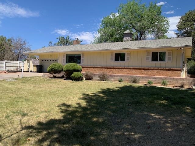 570 Southwest 2nd Court Cedaredge, CO 81413 - Photo 2 of 32 a front view of house with yard and seating area