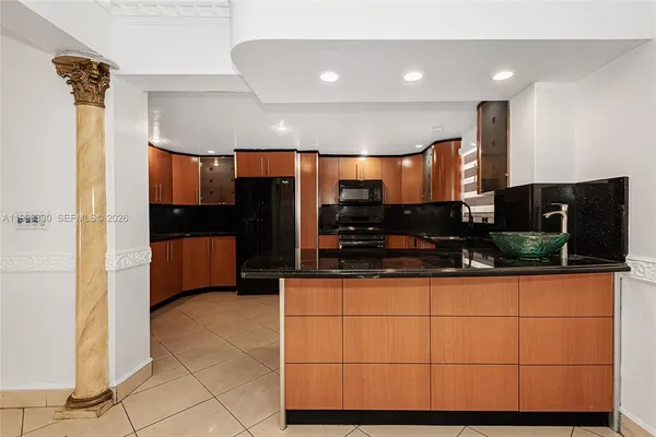 a kitchen with stainless steel appliances a counter top space cabinets and a counter top space