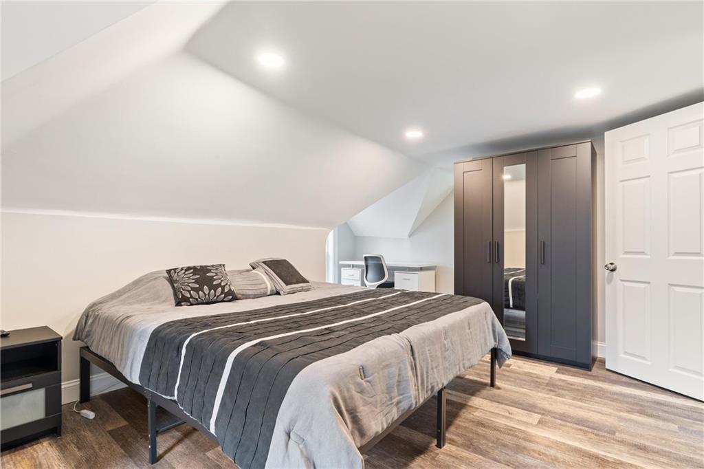 31 Harrison Street Pittsburgh, PA 15205 - Photo 11 of 27 a bedroom with a bed and a mirror