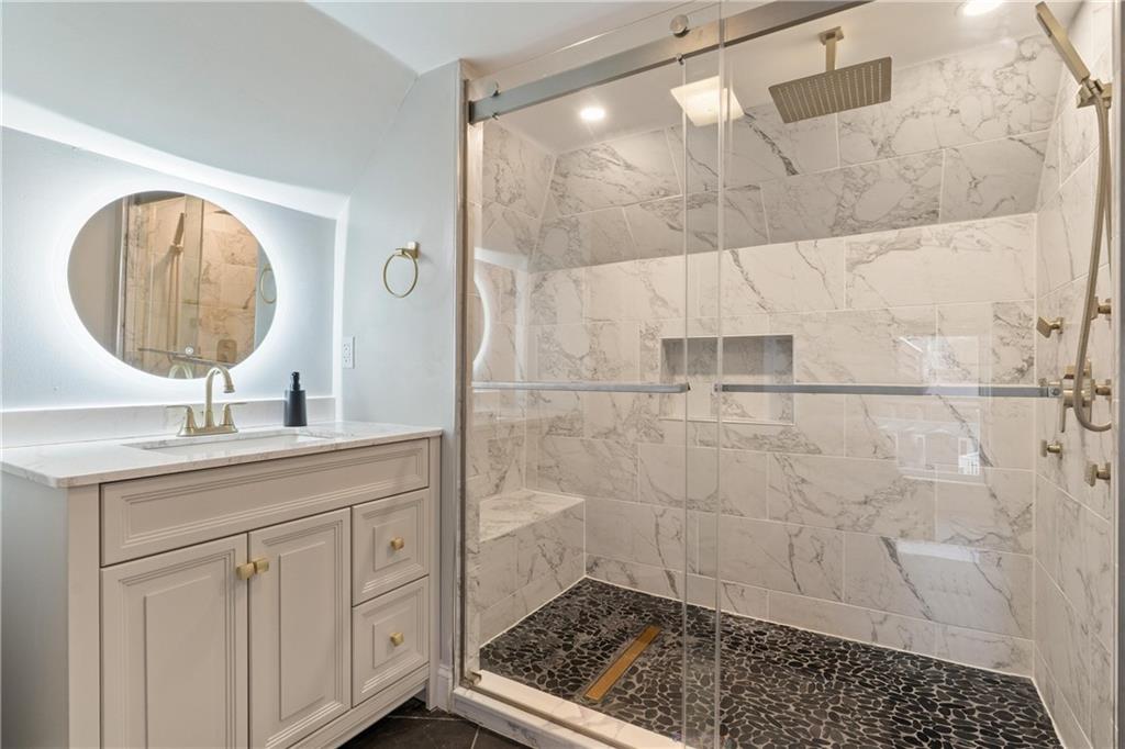 31 Harrison Street Pittsburgh, PA 15205 - Photo 13 of 27 a bathroom with a sink a toilet and a shower