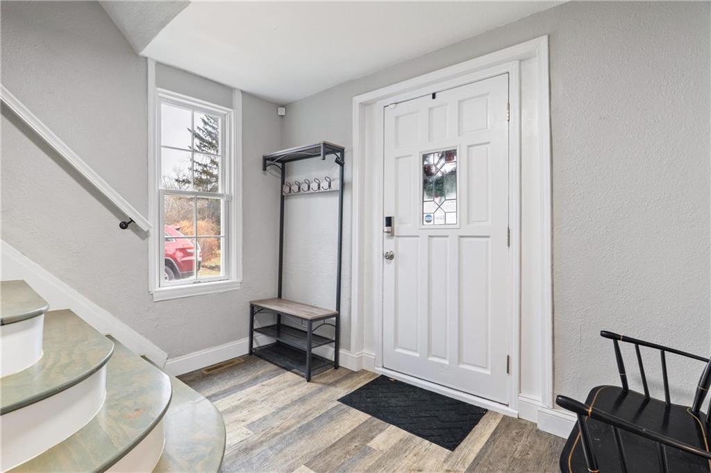 31 Harrison Street Pittsburgh, PA 15205 - Photo 2 of 27 a view of an entryway with wooden floor and windows