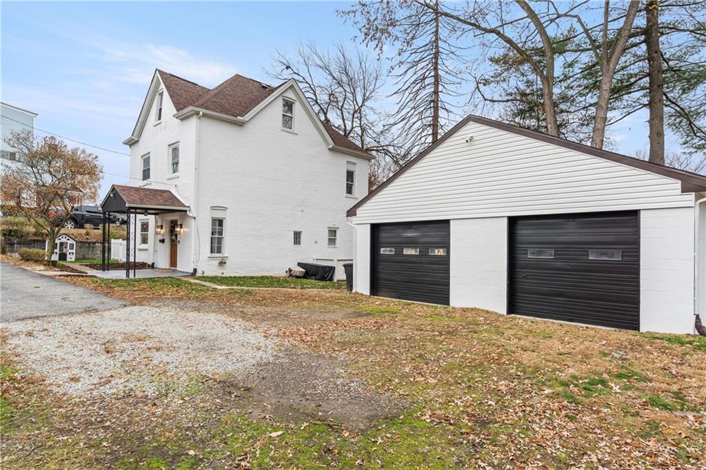 31 Harrison Street Pittsburgh, PA 15205 - Photo 22 of 27 a front view of a house with a yard and garage