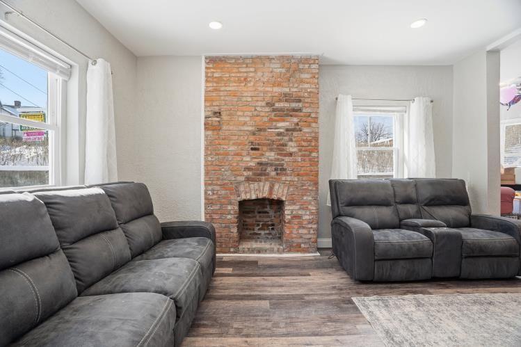 31 Harrison Street Pittsburgh, PA 15205 - Photo 4 of 27 a living room with furniture a flat screen tv and a fireplace