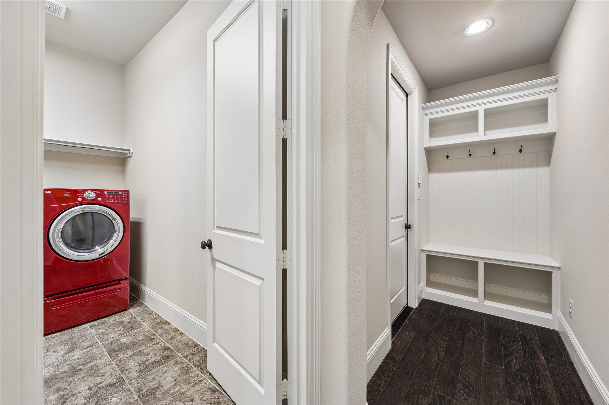 3 Tiburon Court Spring, TX 77389 - Photo 18 of 34 Every great home has a space that quietly keeps life organized, and this one was designed with everyday living in mind. As you enter from the garage, you're greeted by a beautifully crafted mudroom complete with built-in cubbies, hooks, and a storage bench—the perfect place to kick off shoes, hang backpacks, drop sports gear, or keep leashes and umbrellas within easy reach.
