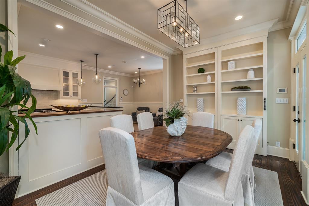 2315 Routh Street Dallas, TX 75201 - Photo 14 of 38 a view of a dining room with furniture and a chandelier