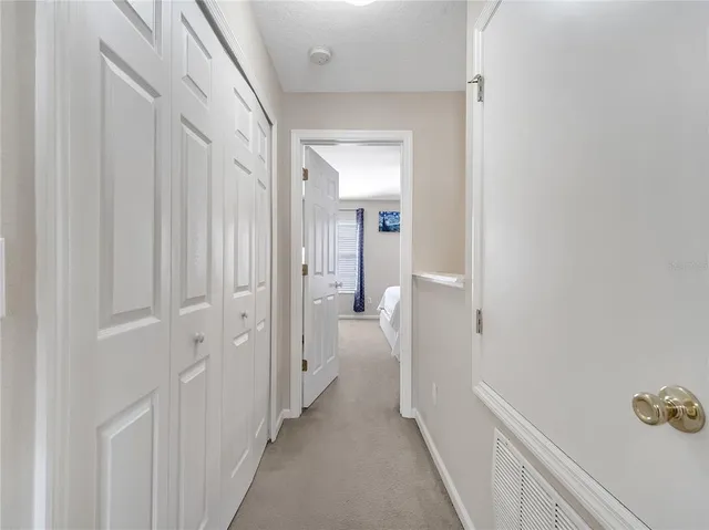 a view of a bathroom from a hallway