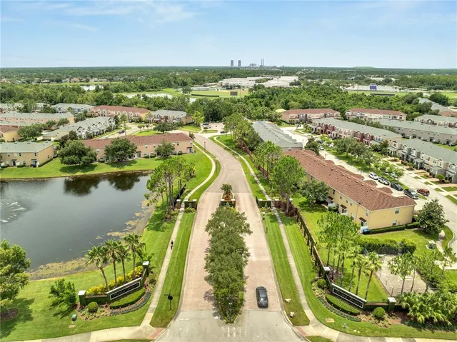 an aerial view of a residential houses with outdoor space