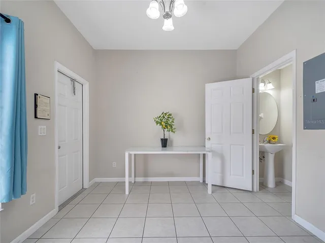 a white tub sitting in a en suite bathroom