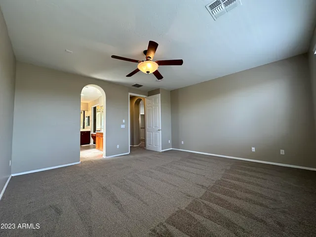 a large bathroom with a large tub and sink