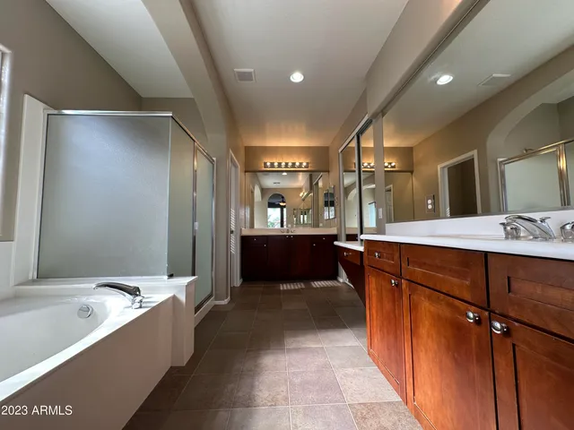 a bathroom with a bathtub and a shower