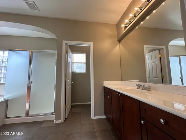 a white toilet sitting next to a small sink