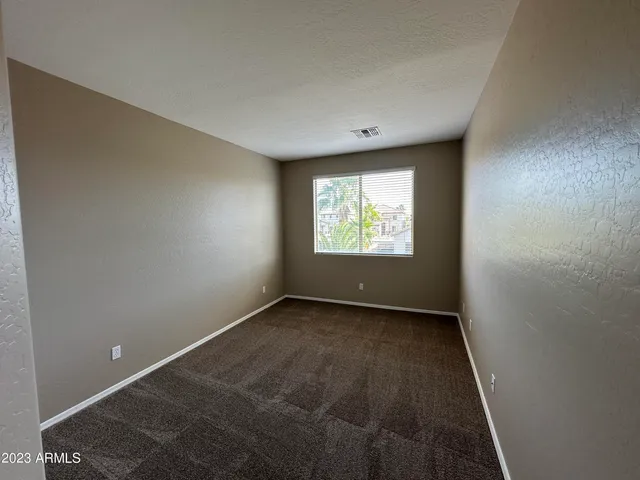 a bathroom with a double vanity sink and a toilet