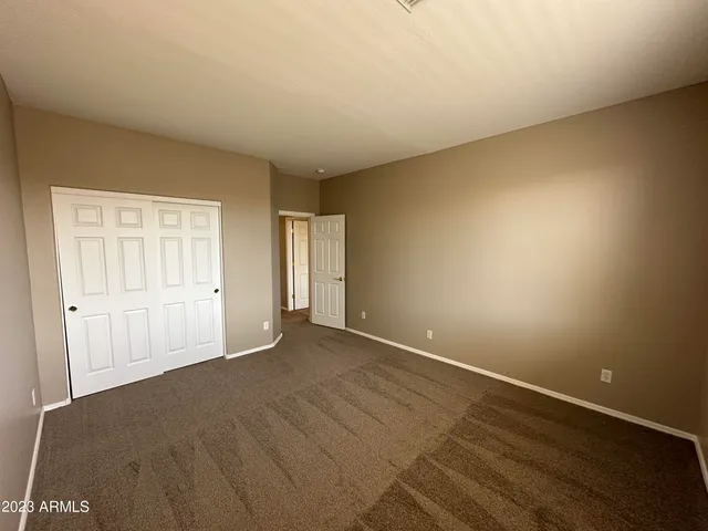 a bathroom with a double vanity sink toilet and shower