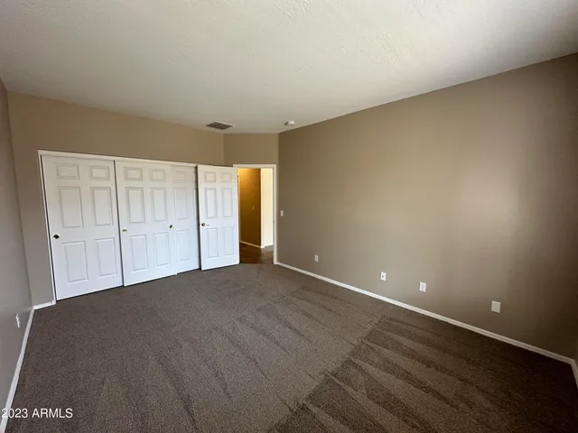 a view of a house with backyard and porch