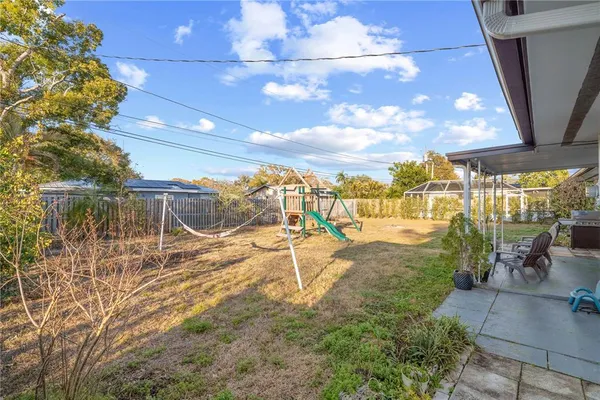 a view of a yard with table and chairs