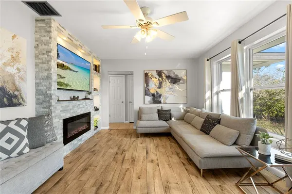 a living room with furniture and a fireplace