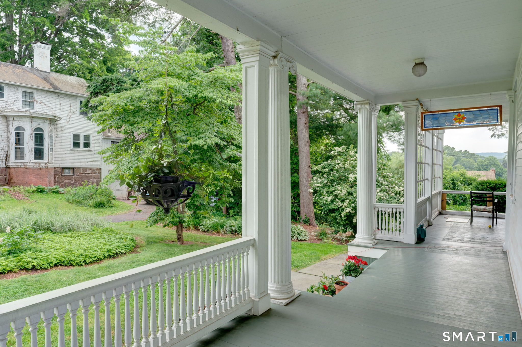 840 Worthington Ridge Berlin, CT 06037 - Photo 23 of 33 Spend lazy afternoons on the side porch with stunning views of the sunset (photo 2023)