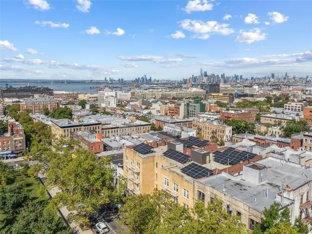 a view of a city with an ocean