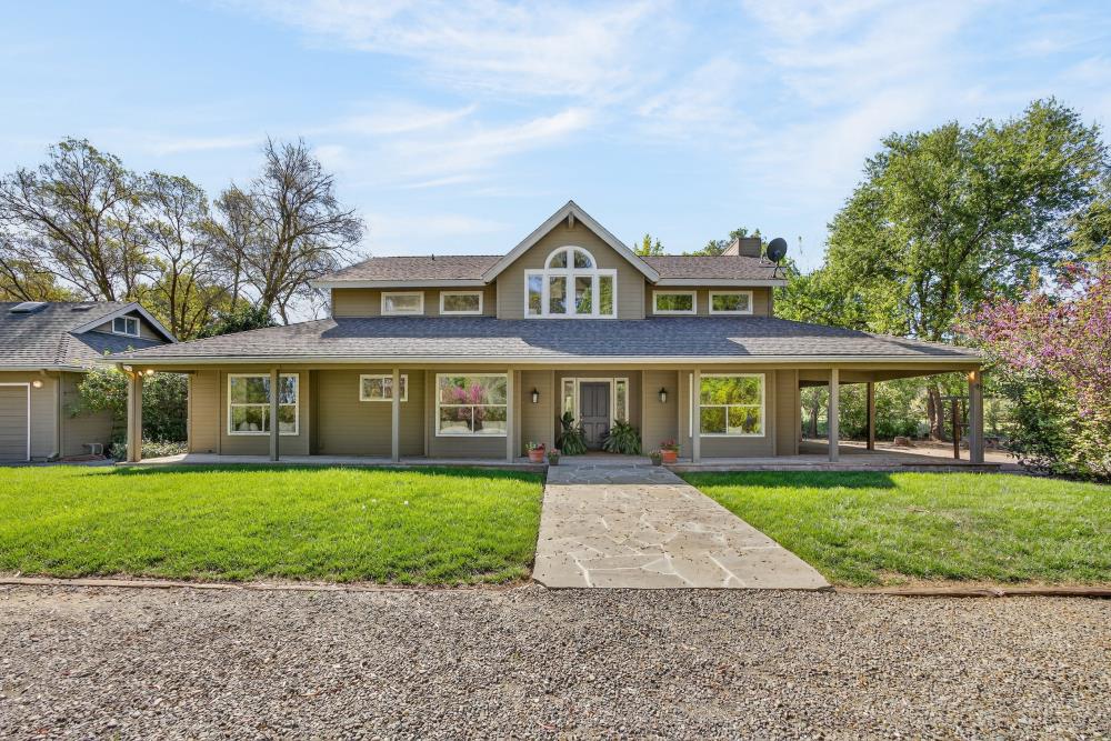 35692 Acadia Lane Davis, CA 95616 - Photo 1 of 1 a front view of a house with a yard and trees