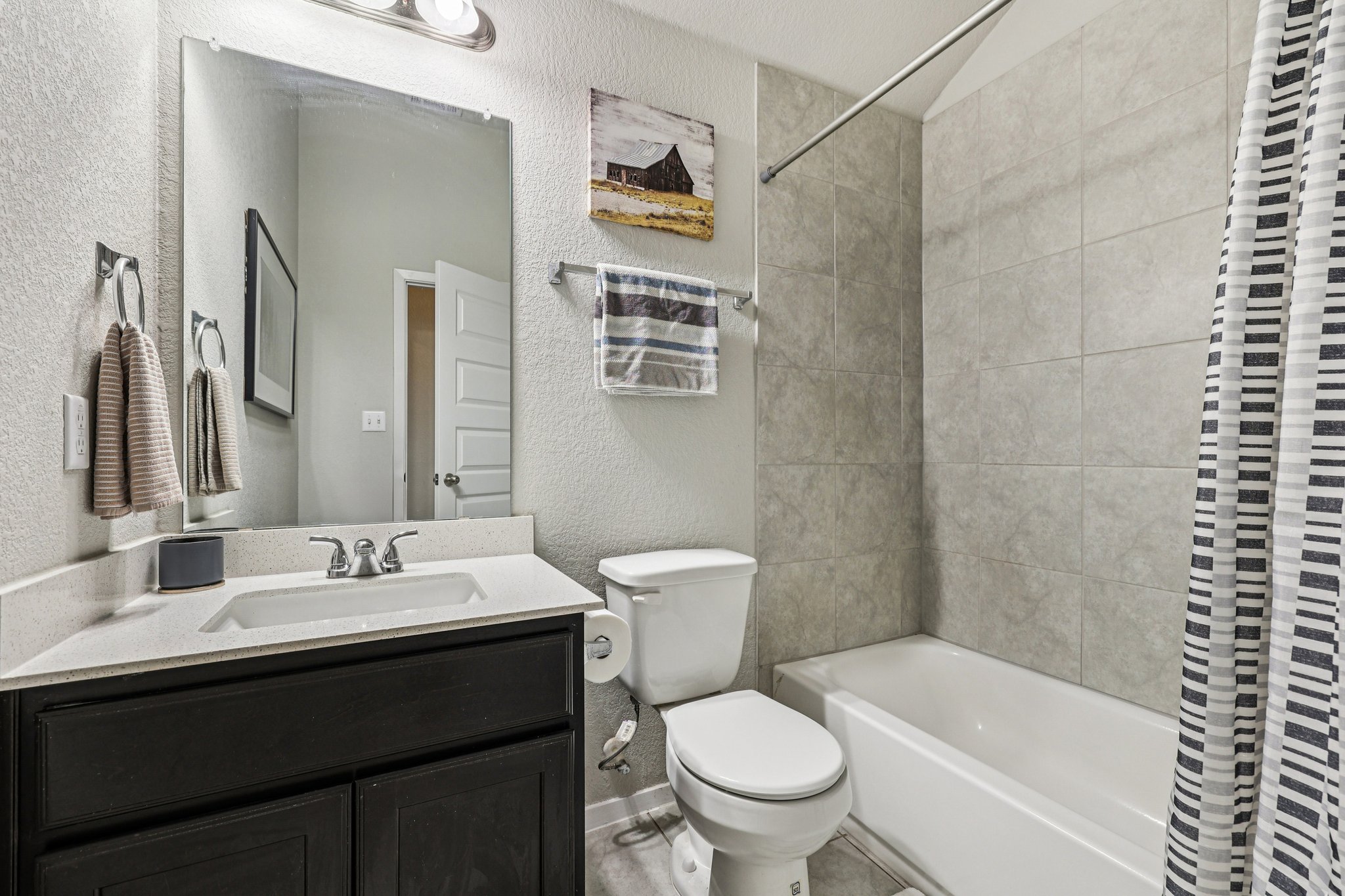 111 Insider Loop Elgin, TX 78621 - Photo 19 of 39 a bathroom with a sink a toilet and shower