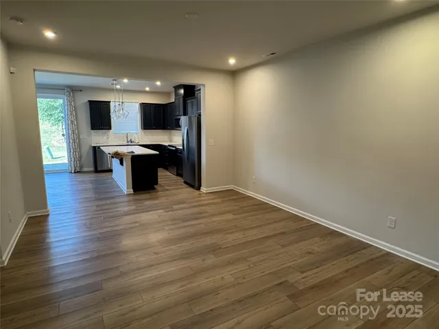 a view of kitchen with sink and natural light