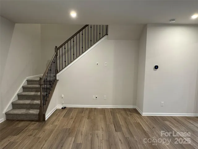 a view of entryway with wooden floor