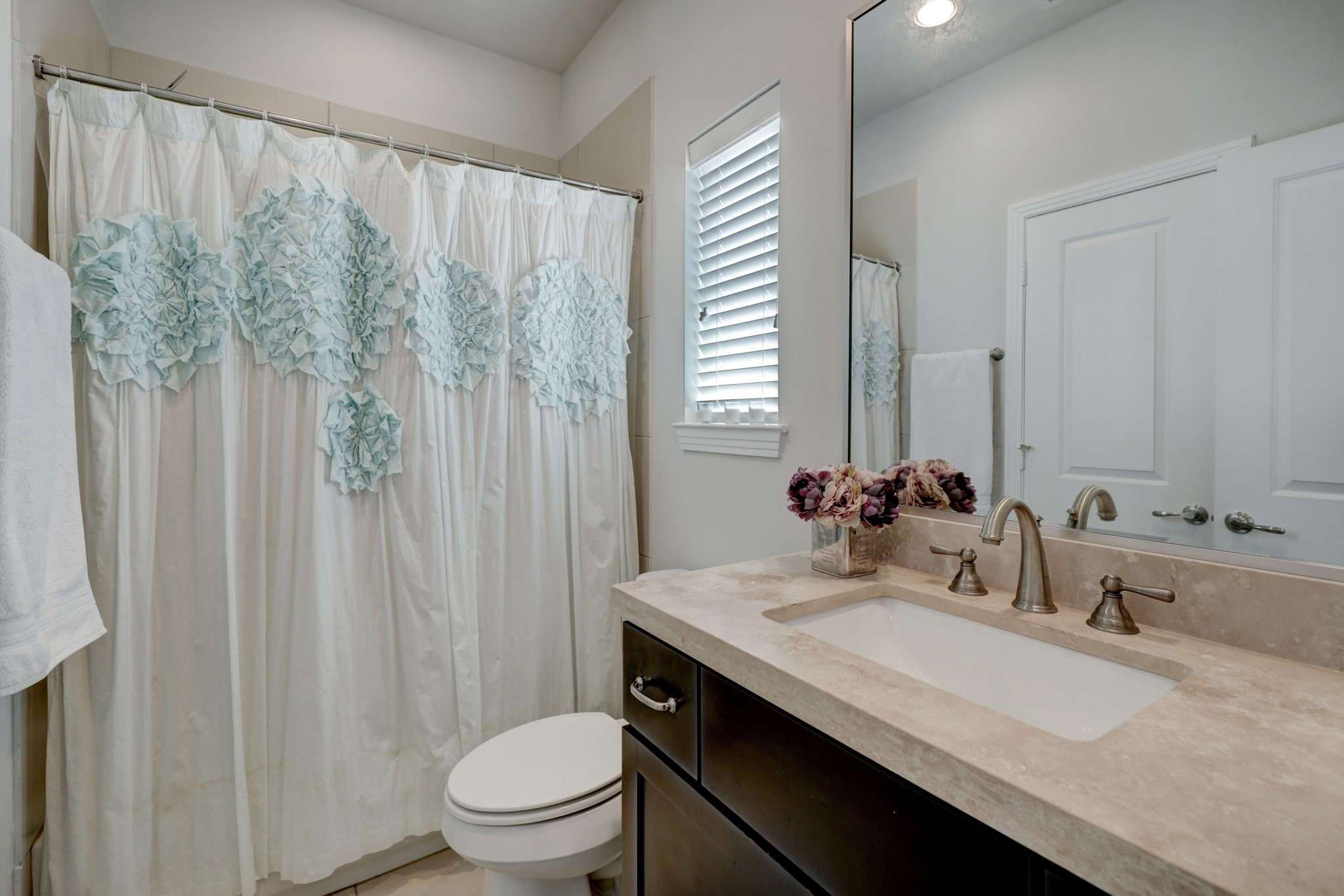2231 Chenevert Street Houston, TX 77003 - Photo 19 of 26 a bathroom with a granite countertop sink and a mirror