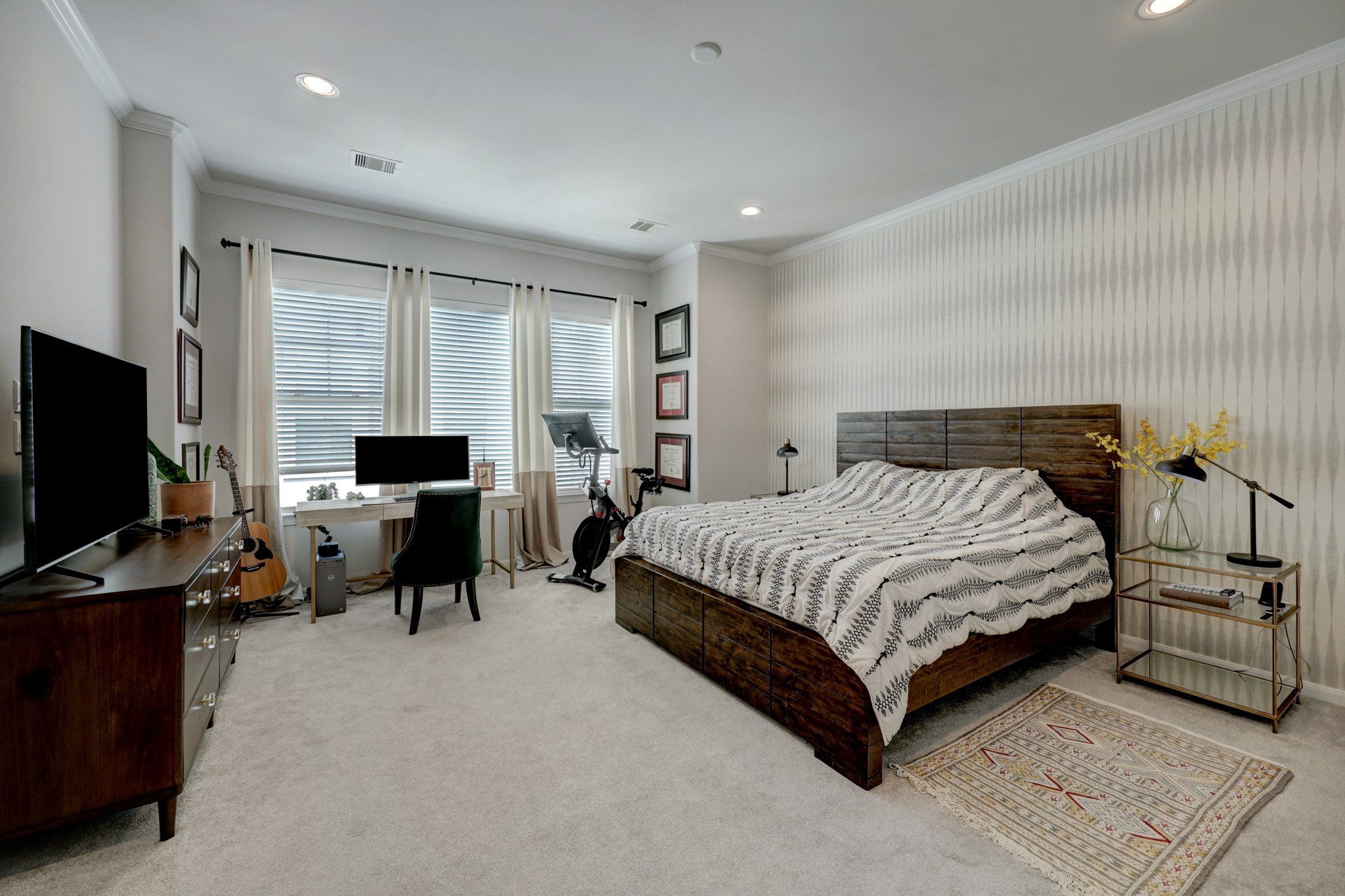 2231 Chenevert Street Houston, TX 77003 - Photo 20 of 26 a bedroom with a bed and a flat screen tv