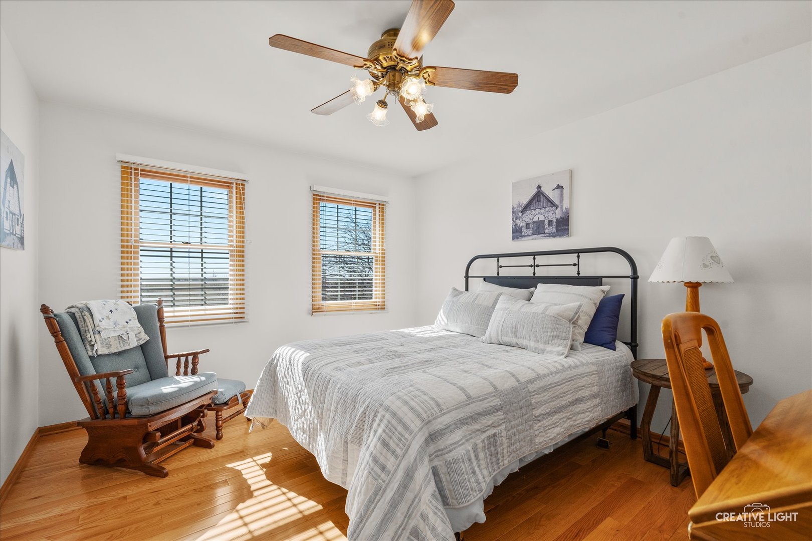 1651 Johnson Road Oswego, IL 60543 - Photo 26 of 60 a bedroom with a bed and a chandelier