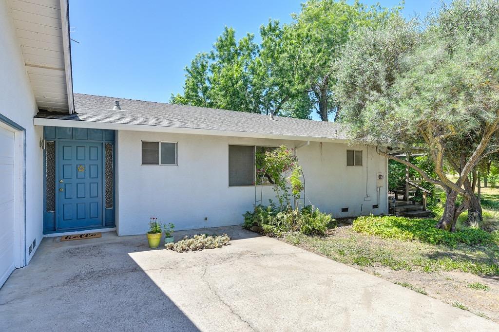 a front view of a house with garden
