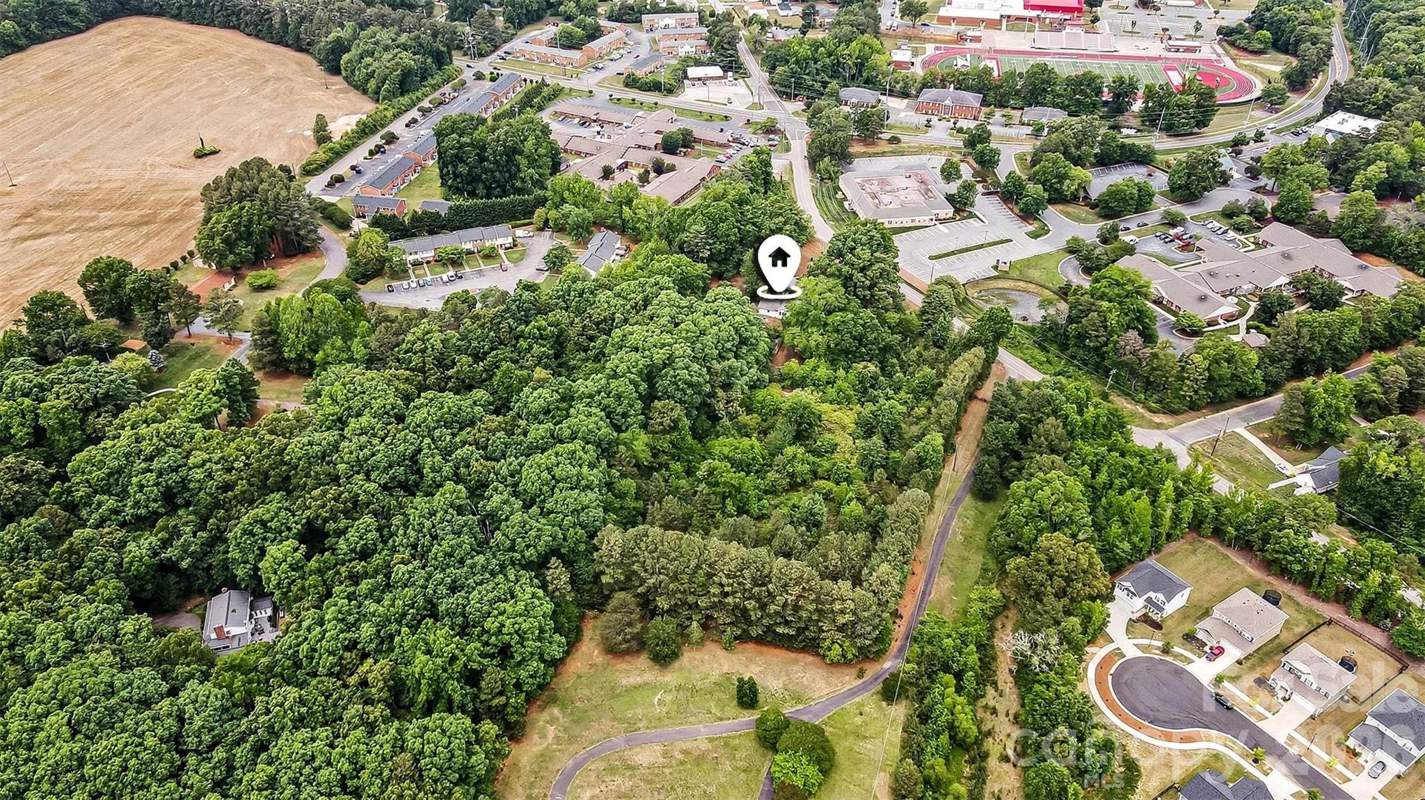 1116 Medlin Road Monroe, NC 28112 - Photo 31 of 40 an aerial view of residential houses with outdoor space and street view