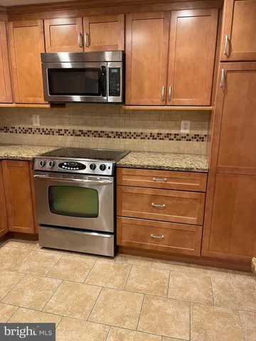 a kitchen with a stove and a microwave