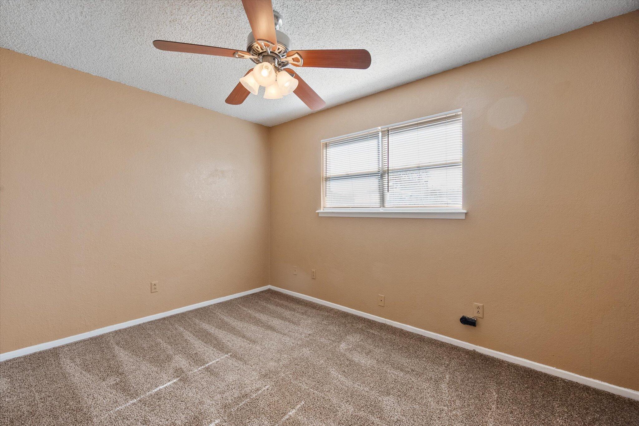 6407 28th Street Lubbock, TX 79407 - Photo 19 of 23 an empty room with a window