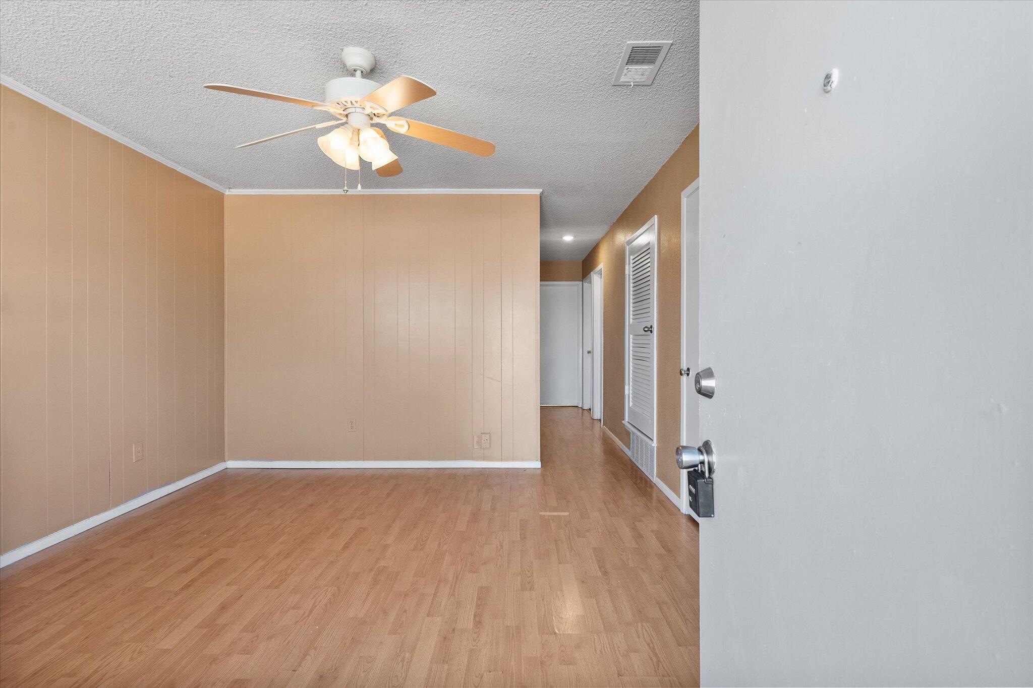 6407 28th Street Lubbock, TX 79407 - Photo 3 of 23 a view of a hallway with wooden floor