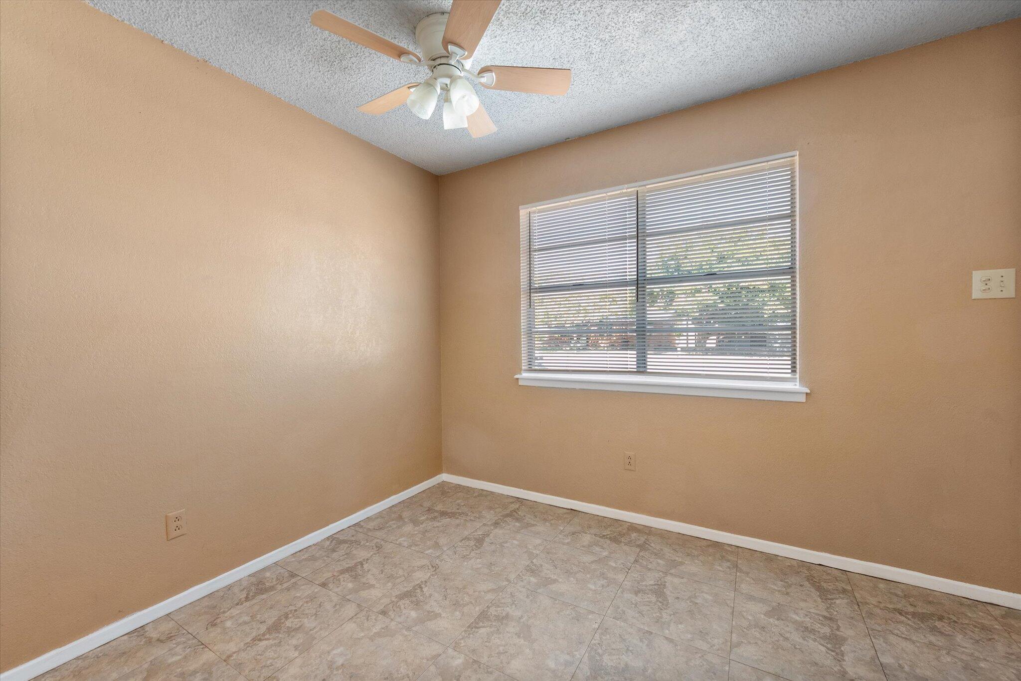 6407 28th Street Lubbock, TX 79407 - Photo 8 of 23 an empty room with a window