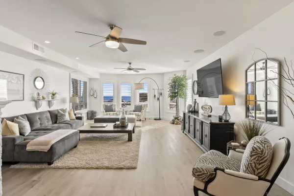 a living room with furniture fireplace and a chandelier
