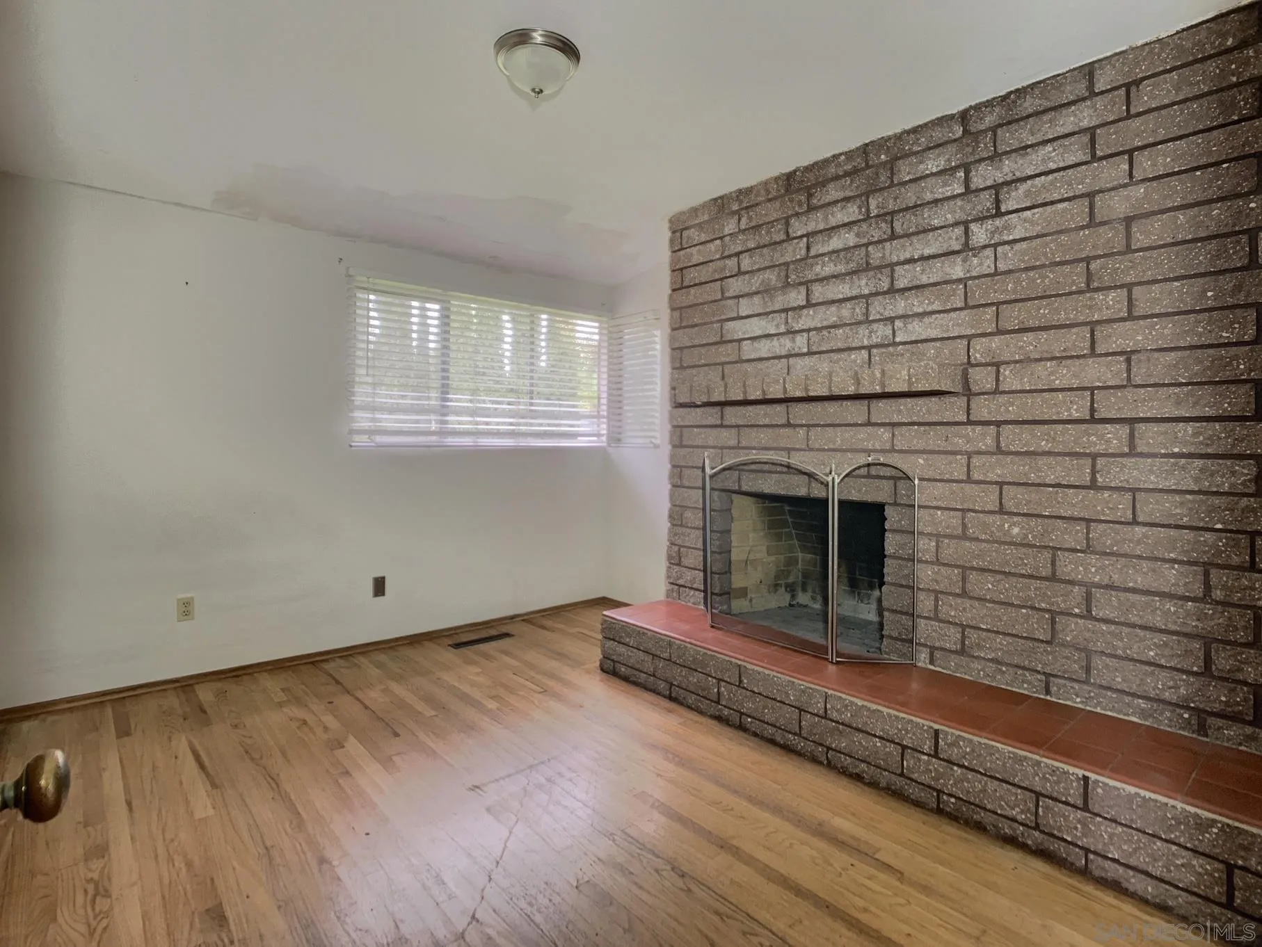 4240 Camino Paz La Mesa, CA 91941 - Photo 14 of 33 a living room with a wooden floor