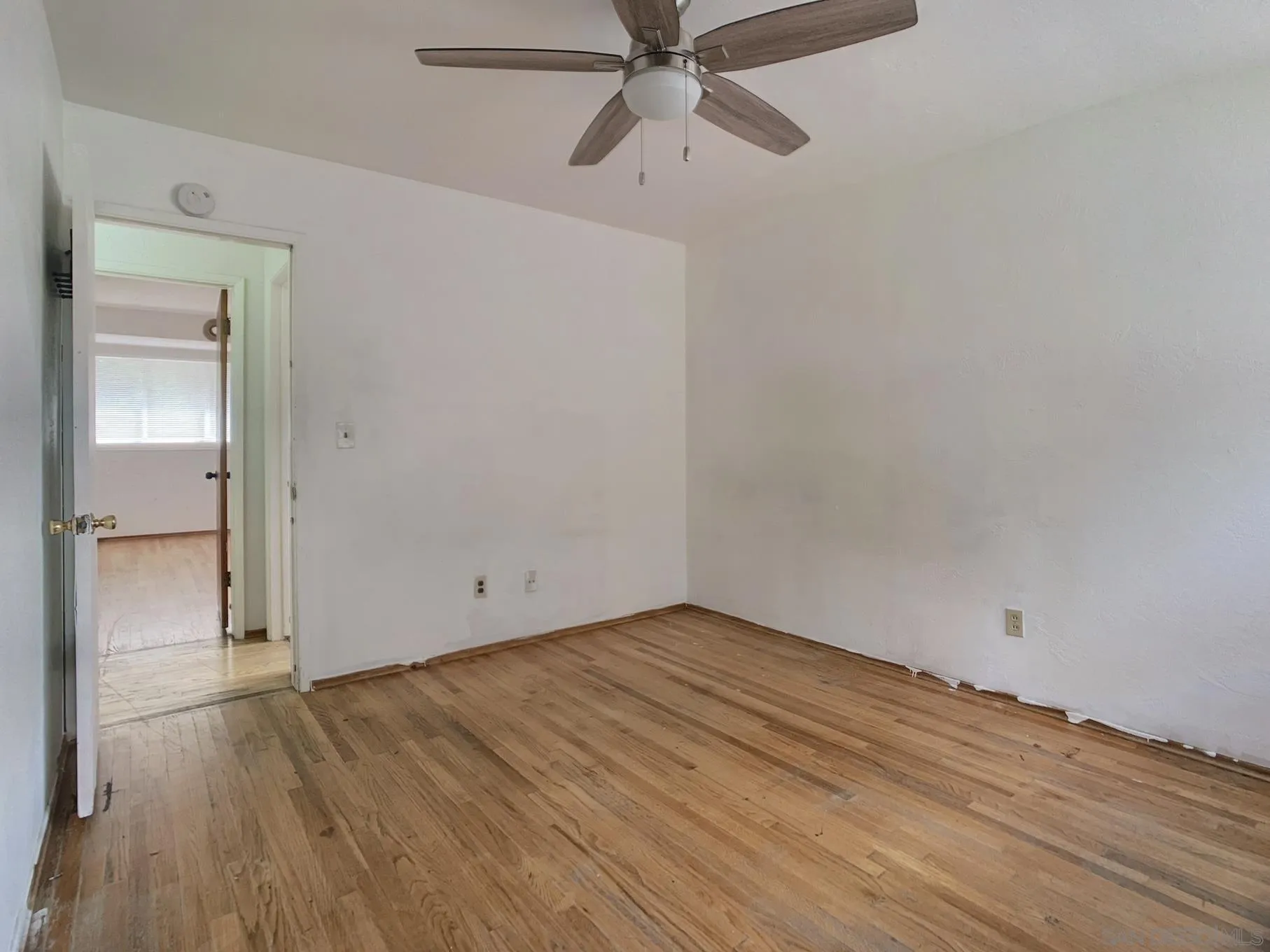4240 Camino Paz La Mesa, CA 91941 - Photo 17 of 33 a view of an empty room with wooden floor